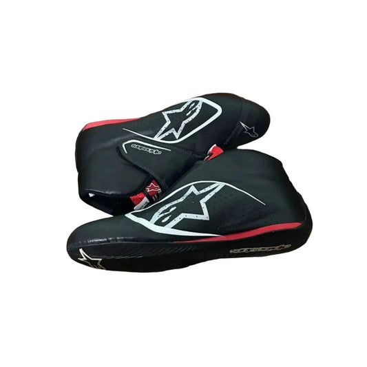 Black Carlos Sainz 2017 F1 racing shoes with a logo on a white background