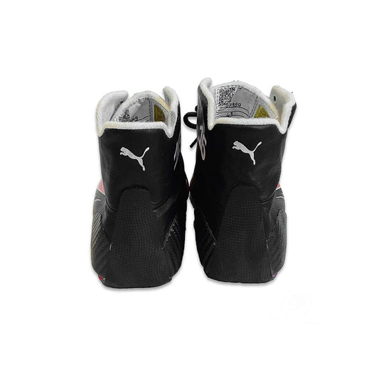 Black high-top Charles Leclerc 2022 F1 Racing shoes with white soles on a white background