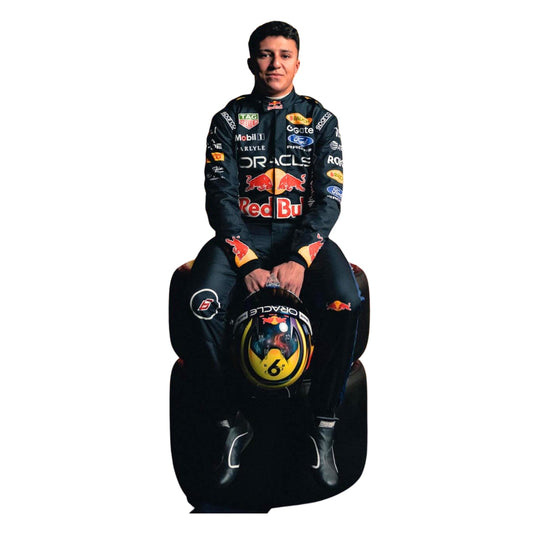Isack Hadjar Wearing 2026 F1 Racing Suit Sitting On A Tyre
