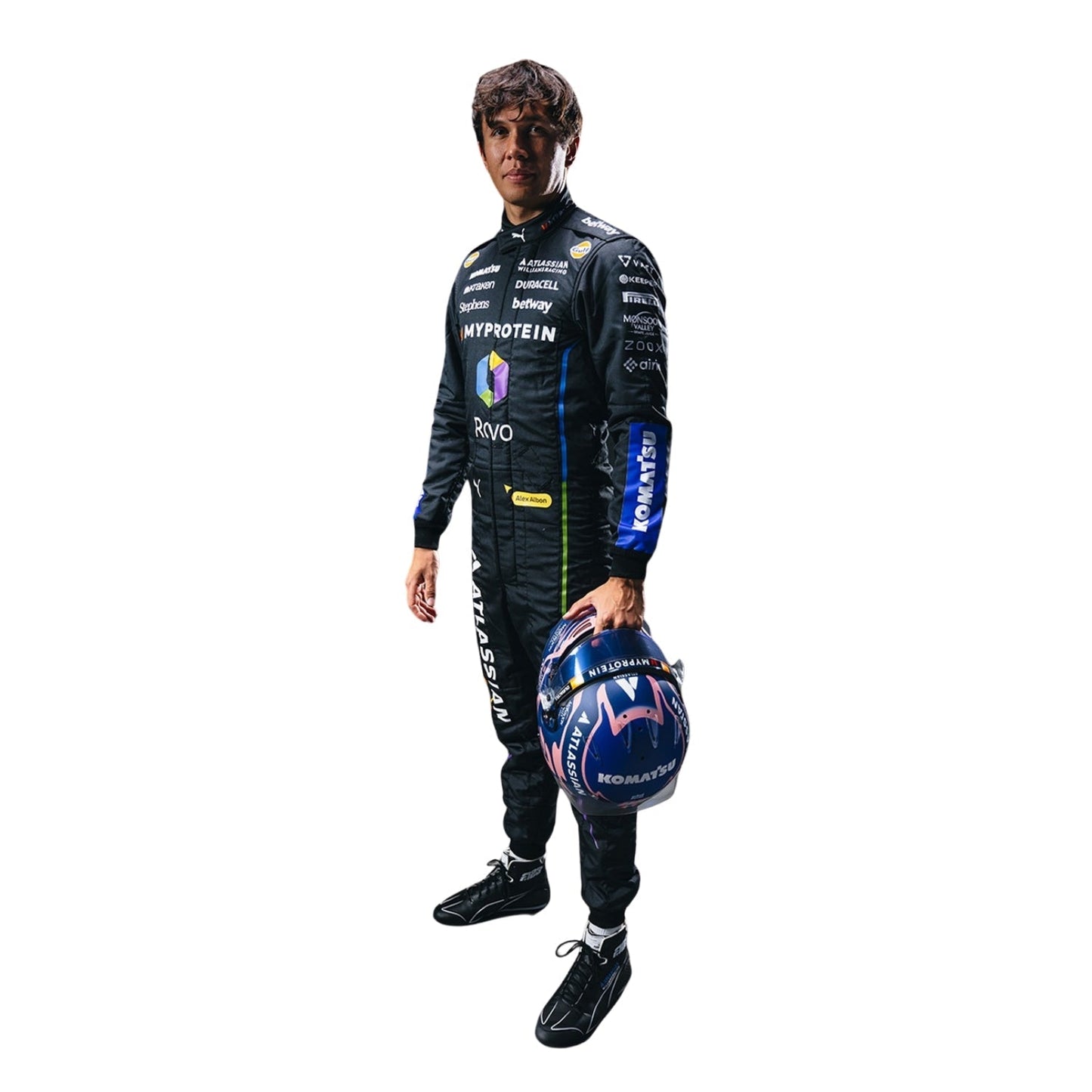 Alexender wearing 2025 las vegas a racing suit holding a helmet on a white background