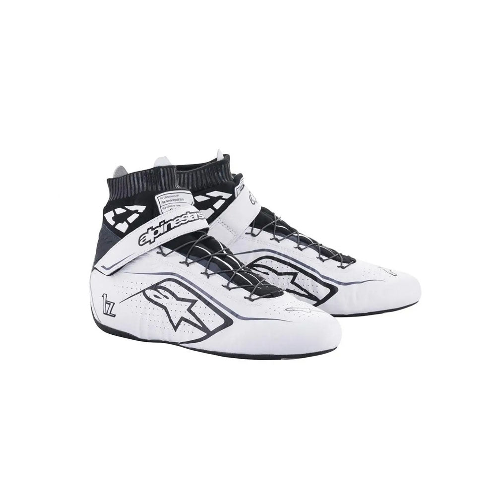 White and black Alpinestars Tech1-Zv2 racing shoes with brand logo on a white background