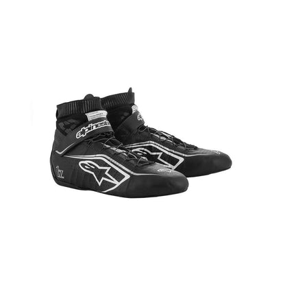 Black Alpinestars Tech1-Zv2 racing shoes with a white logo on a white background