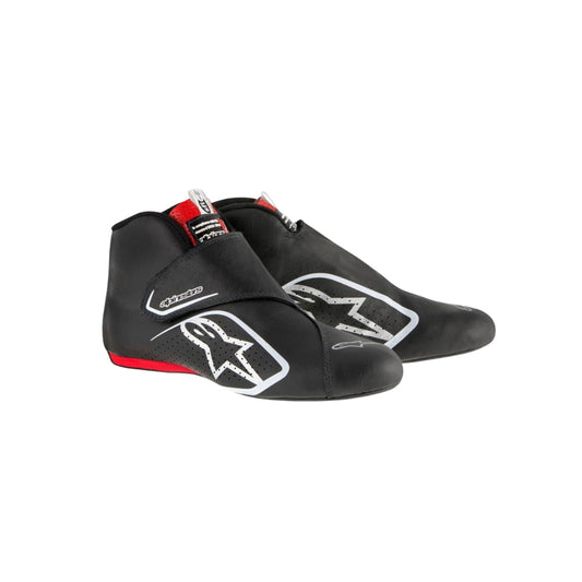 Black Carlos Sainz 2017 F1 racing shoes with visible branding on a white background