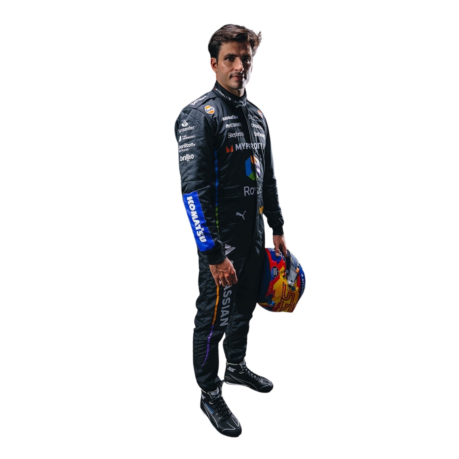Carlos Sainz Full View of wearing a 2025 las vegas racing suit holding a helmet on a white background