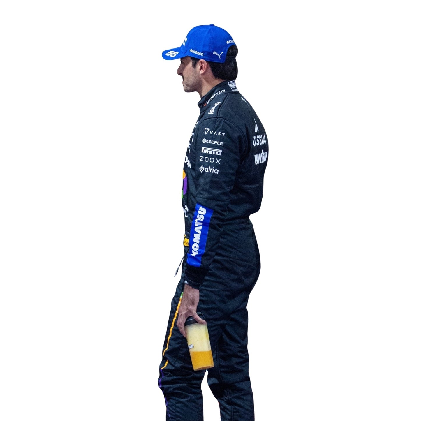 Side Profile of Carlos wearing a racing suit with various sponsor logos on a white background holding a bottle