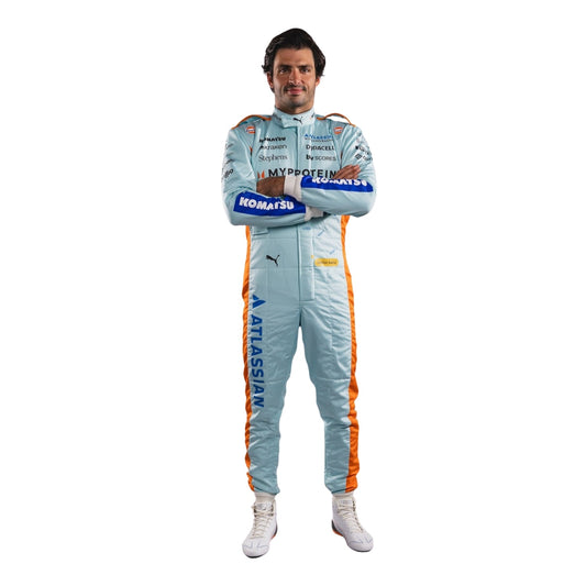 Carlos Front view of wearing a light blue 2025 brazil gp racing suit with various sponsor logos on a white background