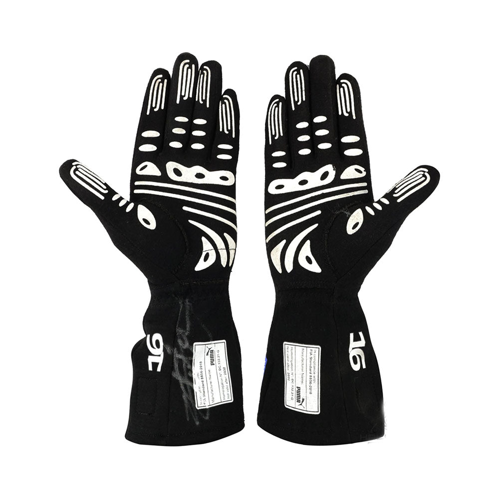 Pair of black Charles Leclerc 2022 F1 racing gloves with white patterns on a white background
