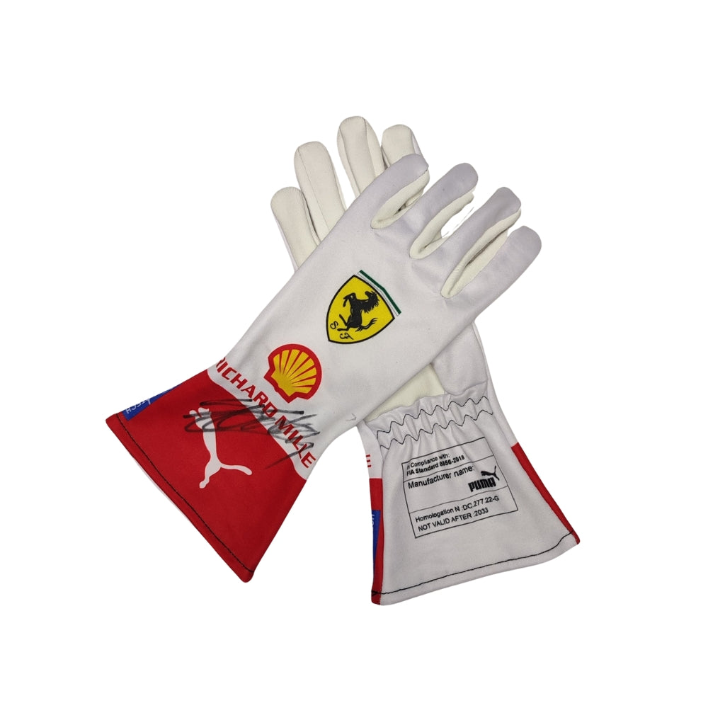 Pair of Charles Leclerc 2023 Monaco GP F1 Racing gloves with Ferrari and Shell logos on a white background