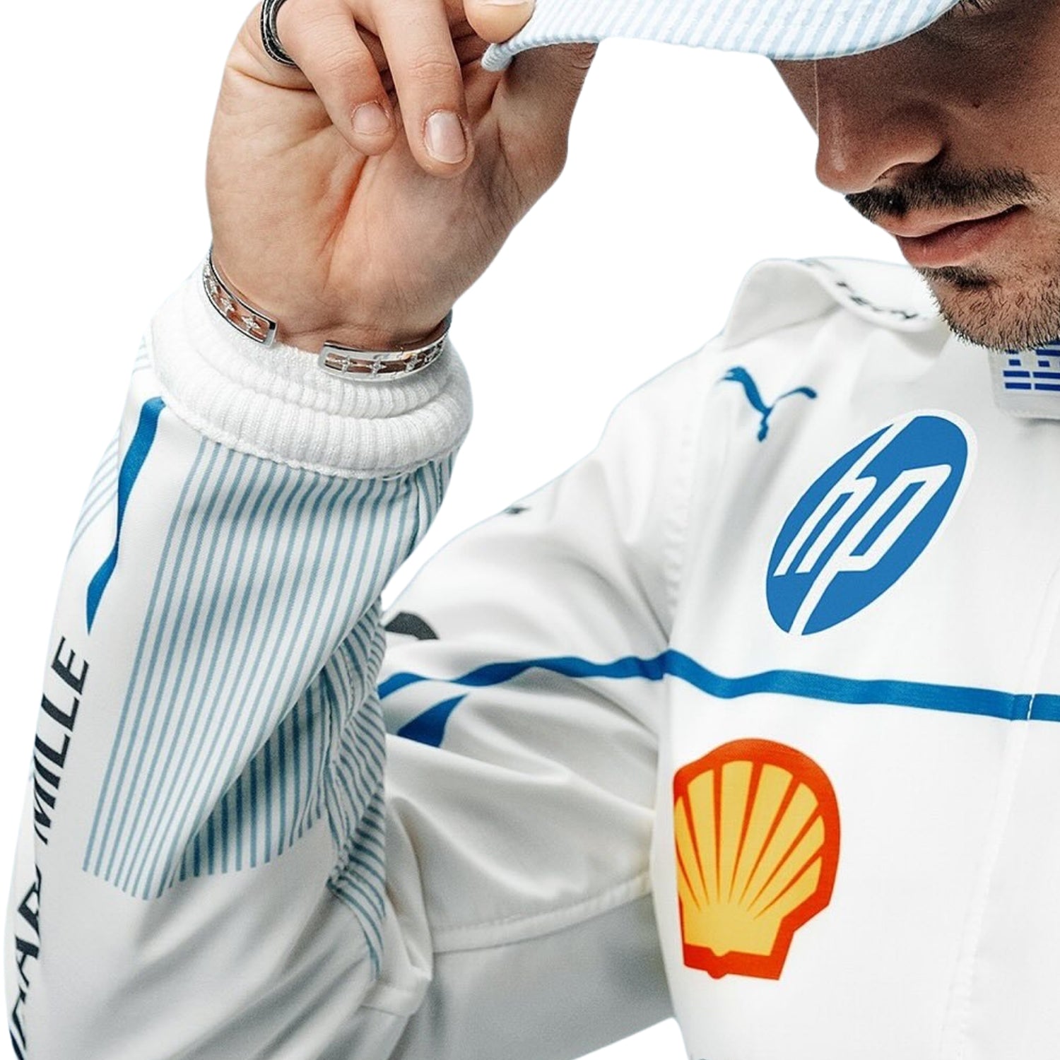 Detailed close-up of the Monaco GP 2025 racing suit showing Charles Leclerc's name, precision-stitched logos, and white and blue detail design.