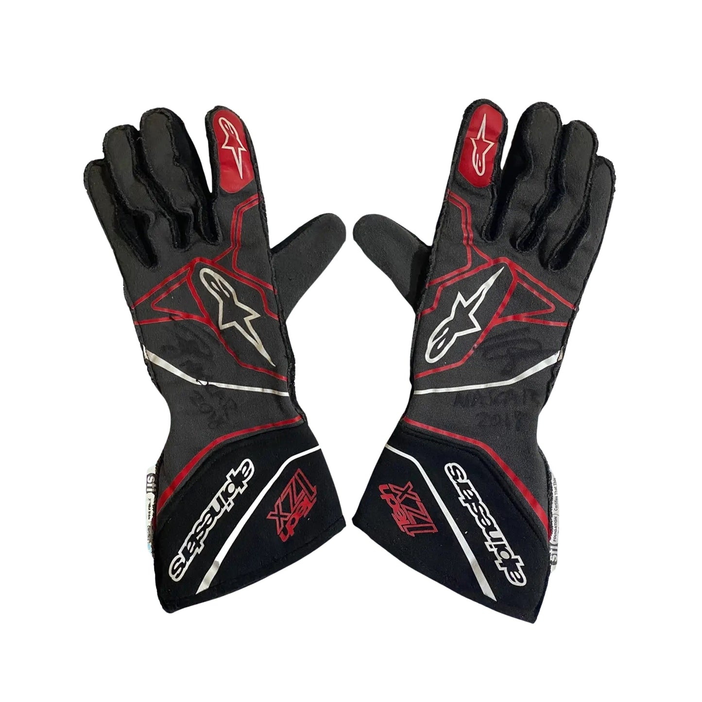 Black and red Conor Daly 2018 NASCAR racing gloves with visible branding on a white background