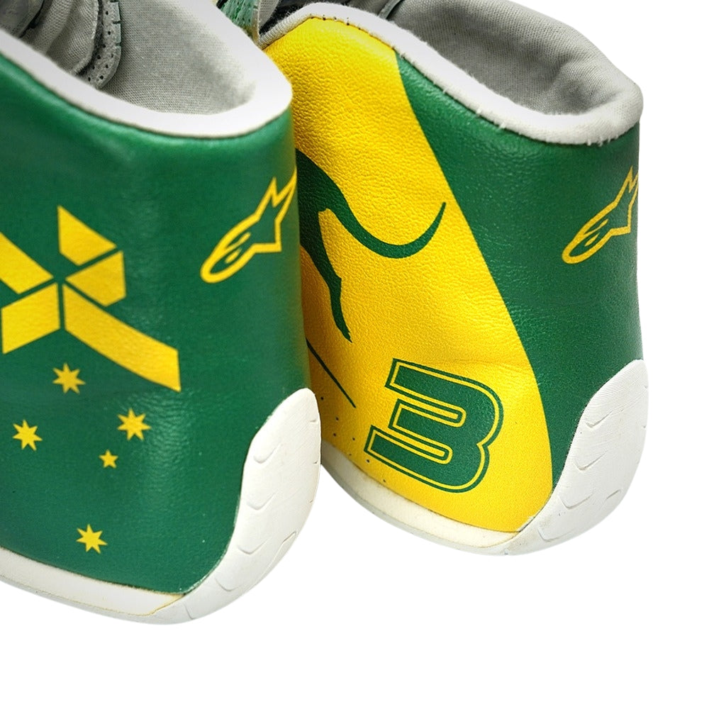 Green and yellow Daniel Ricciardo 2019 Australian Grand Prix F1 racing shoes with a logo and number on a white background