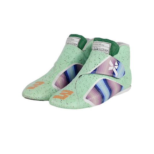 Pair of green Daniel Ricciardo 2021 Honey Badge F1 Racing athletic shoes with colorful sole designs on a white background