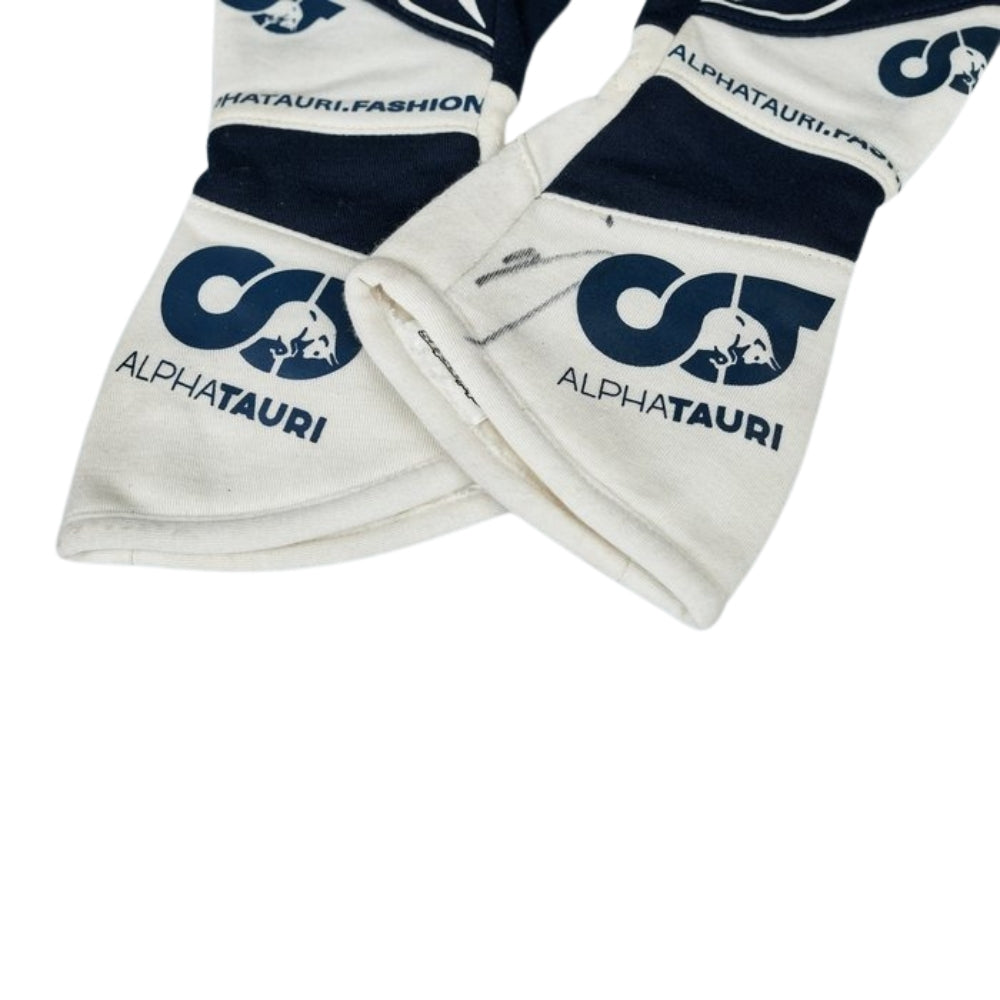 White Daniel Ricciardo 2023 F1 Racing gloves with AlphaTauri logo on a white background