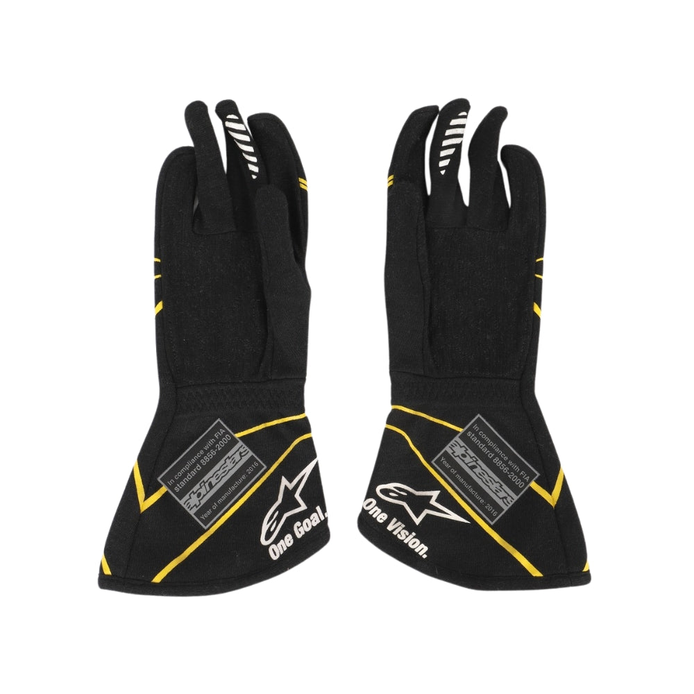 Black Esteban Ocon 2016 F1 racing gloves with yellow accents and brand logos on a white background