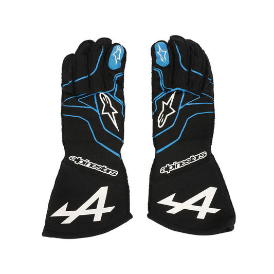 Pair of black Esteban Ocon 2021 F1 racing gloves with blue accents and an Alpinestars logo on a white background