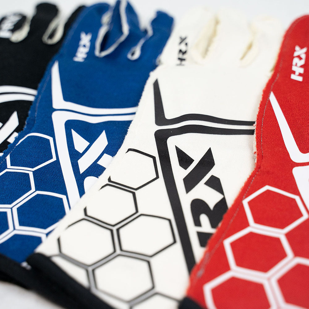 Close-up of various HRX Racing gloves with HRX branding on a white background