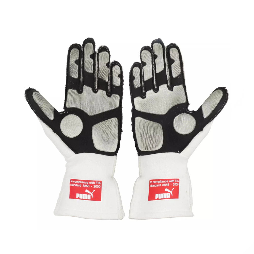 Pair of white and black Fernando Alonso 2010 Japanese GP F1 racing gloves with Puma branding on a white background