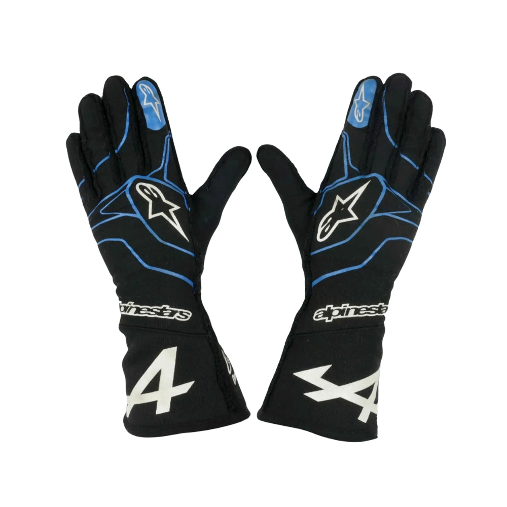 Black Fernando Alonso 2021 F1 racing gloves with blue accents and Alpinestars logo on a white background