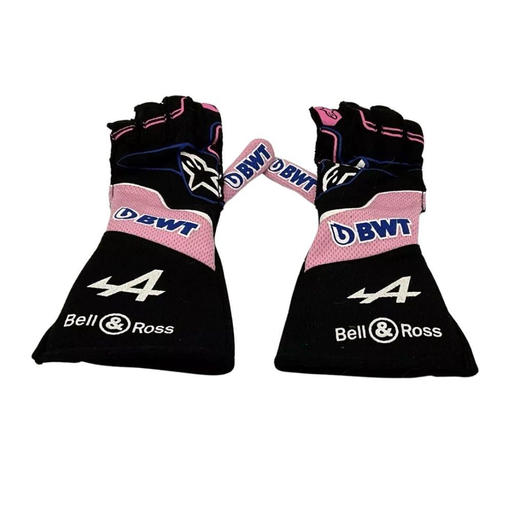 Pair of black and pink Fernando Alonso 2022 F1 Racing gloves with branding on a white background