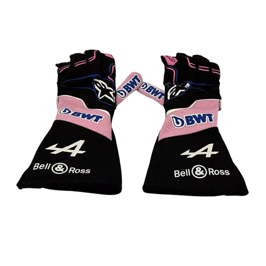 Pair of black and pink Fernando Alonso 2022 F1 Racing gloves with branding on a white background