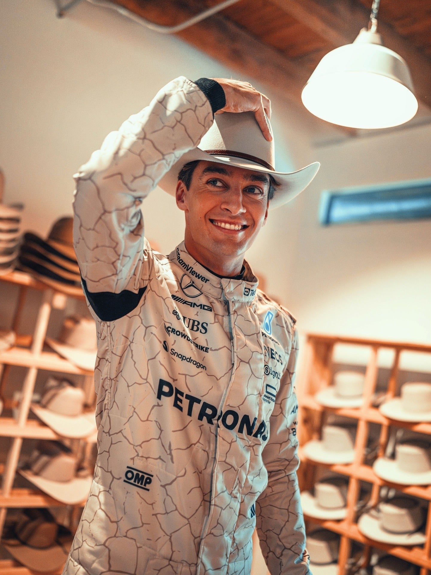 Close-up of stitching, This suit is inspired by the Mojave Desert, and detailing on George Russell 2025 USA Austin GP racing suit