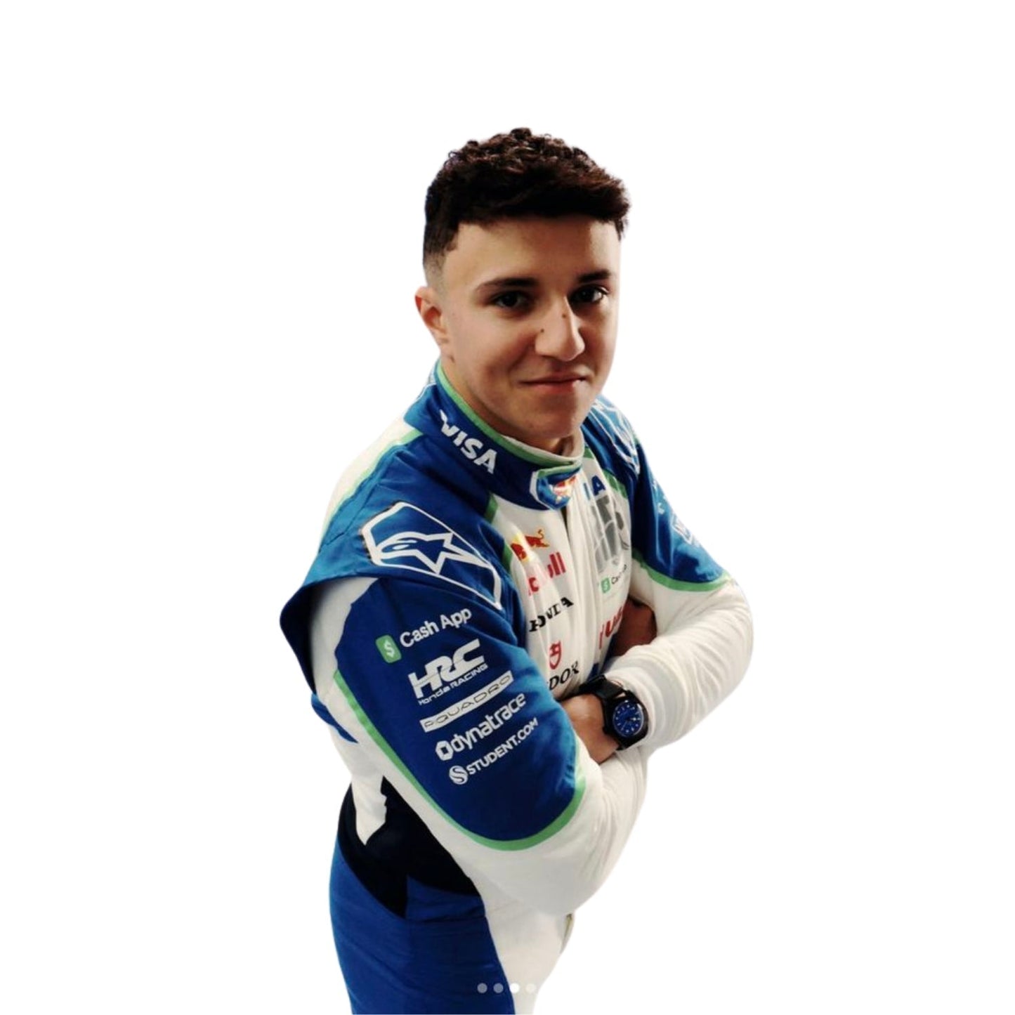 Isack Hadjar standing in his 2025 racing suit, showcasing the front design with blue and green accents.
