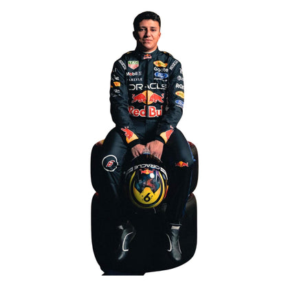 Isack Hadjar Wearing 2026 F1 Racing Suit Sitting On A Tyre