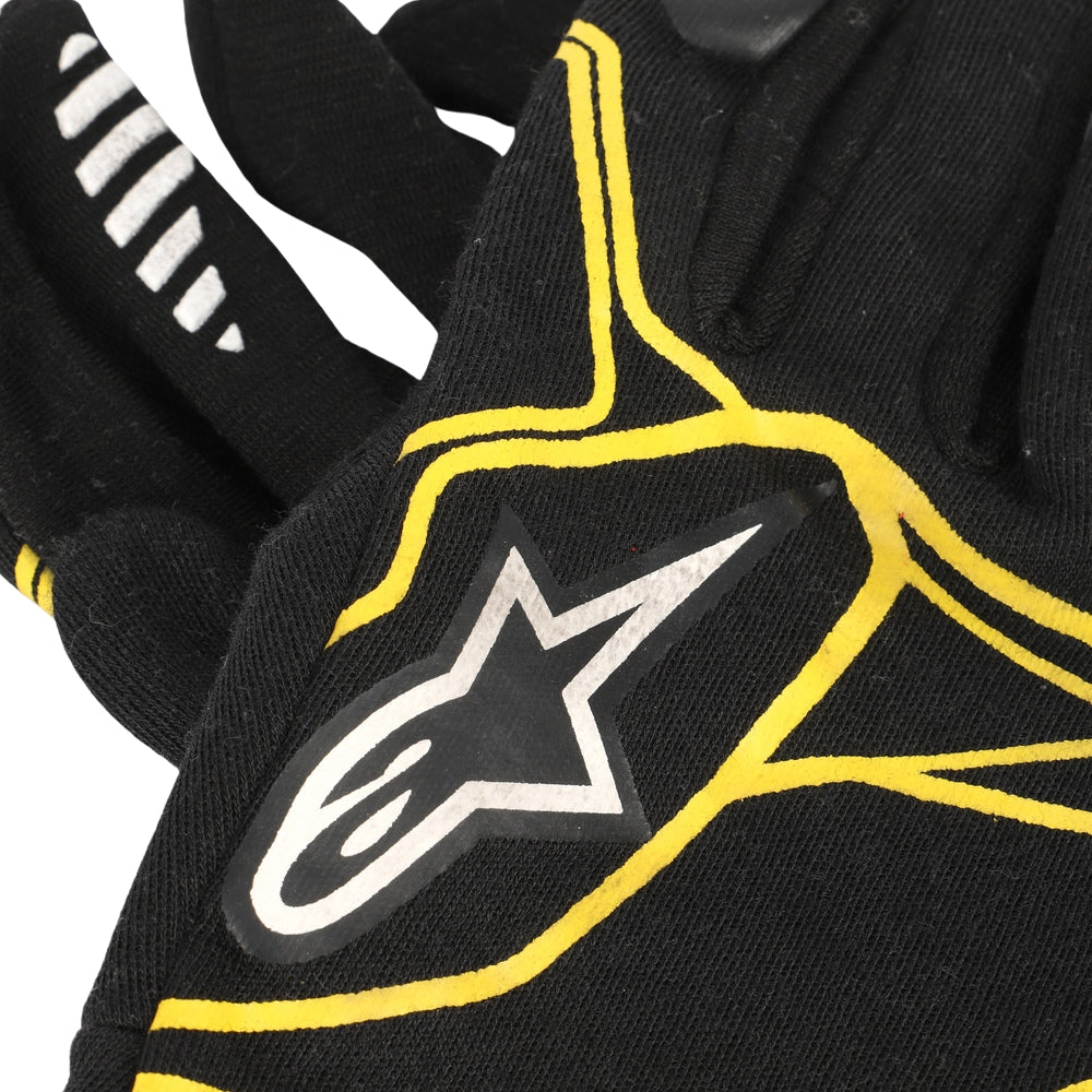 Kevin Magnussen 2016 Black F1 Racing glove with yellow accents and a star logo on a white background