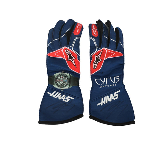 Pair of blue Kevin Magnussen 2022 F1 racing gloves with red and white accents on a white background