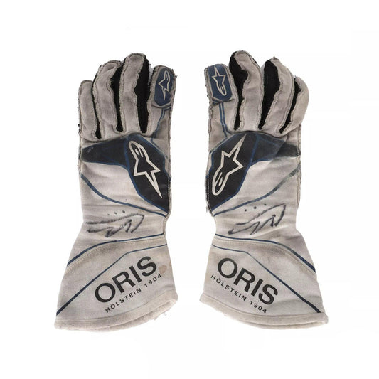 Pair of gray Lance Stroll 2017 F1 Racing gloves with 'Oris' branding on a white background