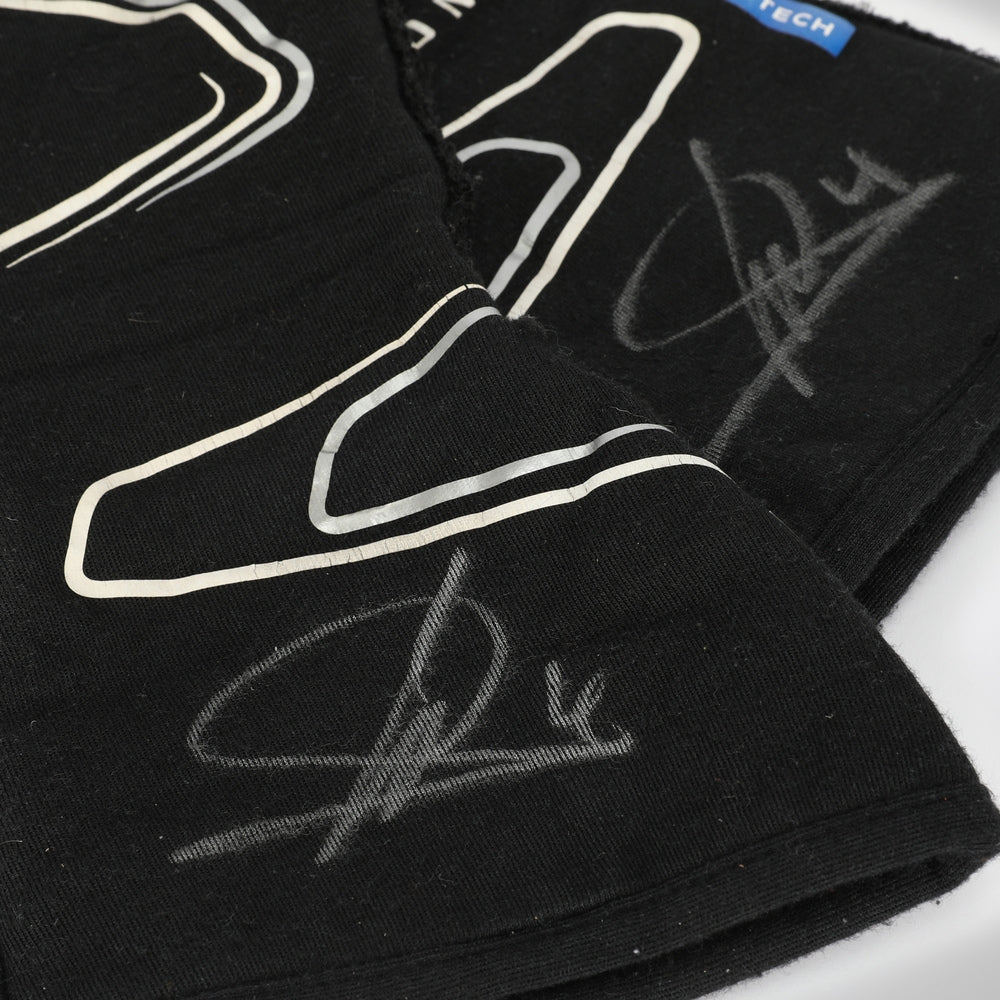 Black Lando Norris 2023 F1 Racing gloves with white outlines and signatures on a white background