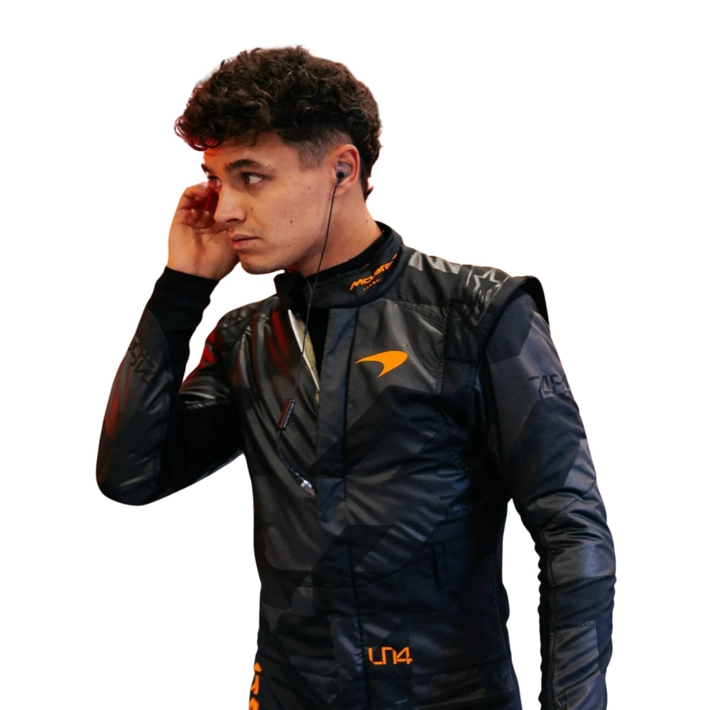 Close-up of Norris with a yellow-black abstract graphic contrasting the matte black suit.