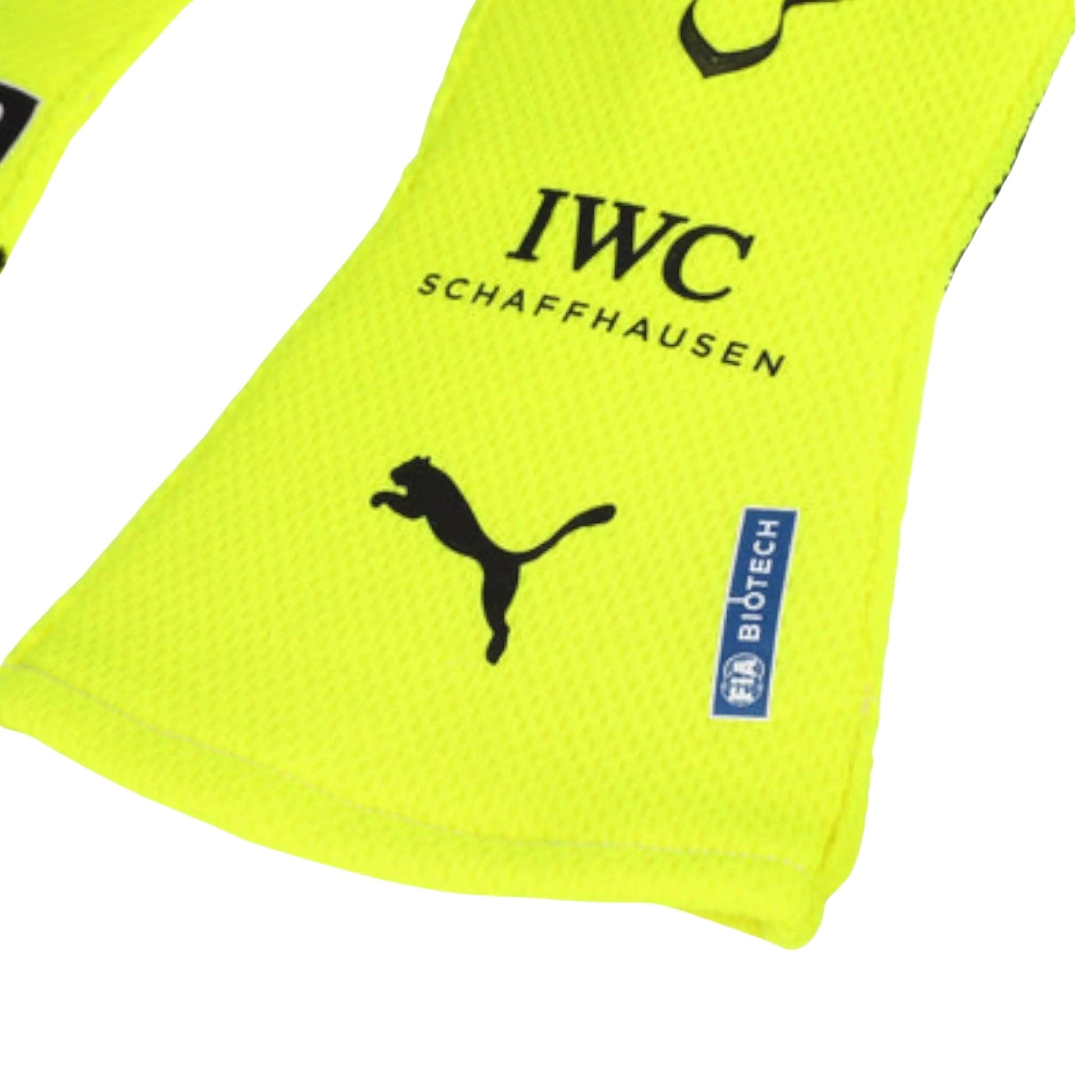 Yellow Lewis Hamilton 2023 F1 Racing glove with Puma logo and 'IWC Schaffhausen' text on a white background