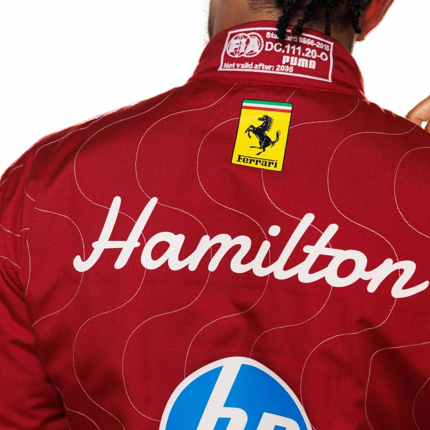 Back Close-up View of Lewis Hamilton's Ferrari Red Monza GP F1 racing suit with 'Hamilton' and Ferrari logo on a white background