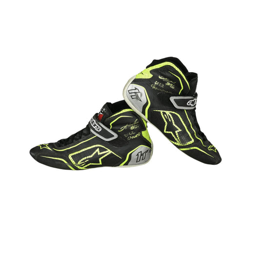 Black and yellow Linus Lunqvist Championship HMD 2022 Indy Lights racing boots on a white background
