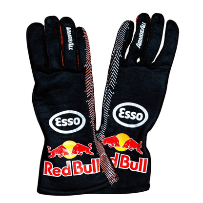 A pair of black Red Bull Racing gloves with Esso branding, featuring the red bull logo and sponsor logos on the back of the hands, shown against a plain white background.