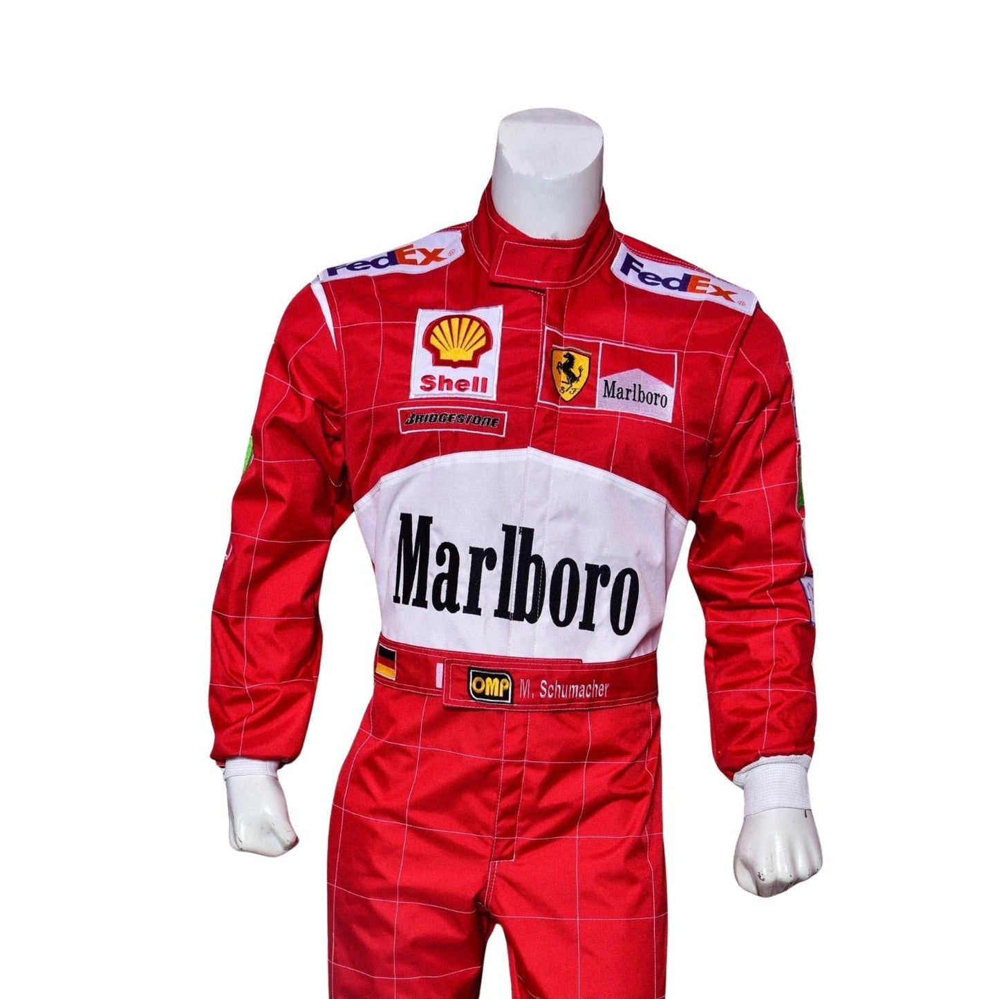 Close-up of Schumacher’s 2000 F1 suit, showing the high-quality stitching, red fabric, and precise logo placement that marked his championship victory.