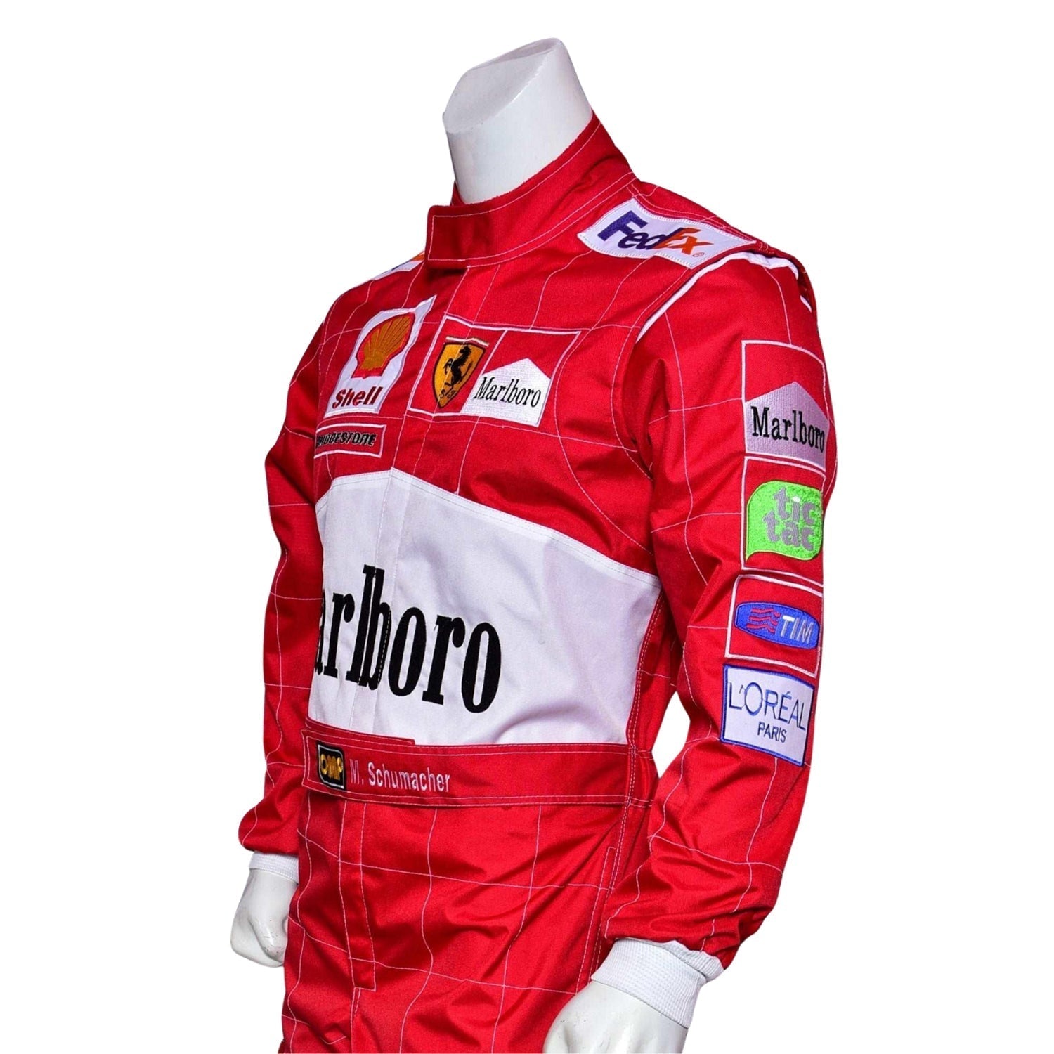 Side angle of the 2001 Schumacher F1 suit showing curved seam design, yellow accents on arms, and racing sponsor logos.