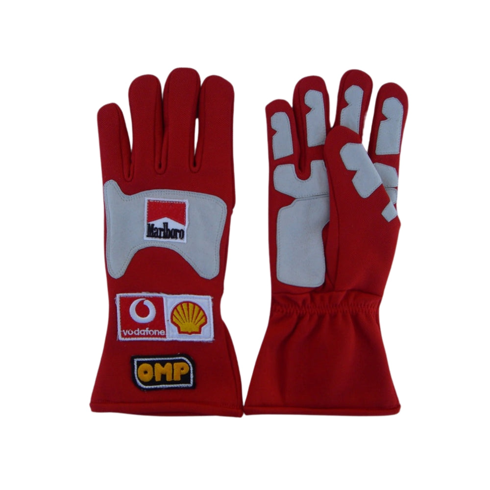 Red Michael Schumacher 2006 F1 Racing gloves with sponsor logos on a white background