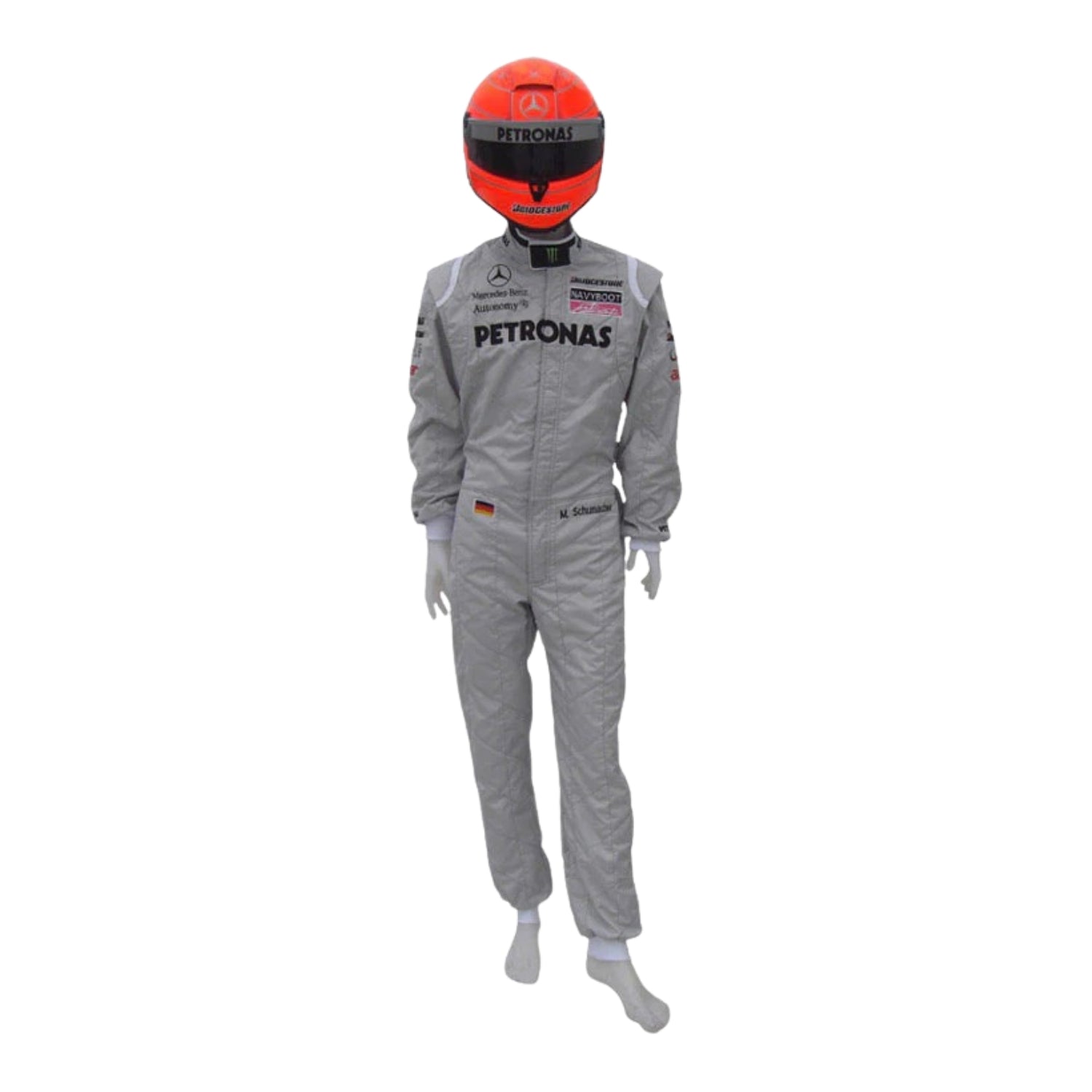 Front view of Michael Schumacher’s 2010 F1 racing suit in silver with green and black accents, featuring signature branding and structured design.