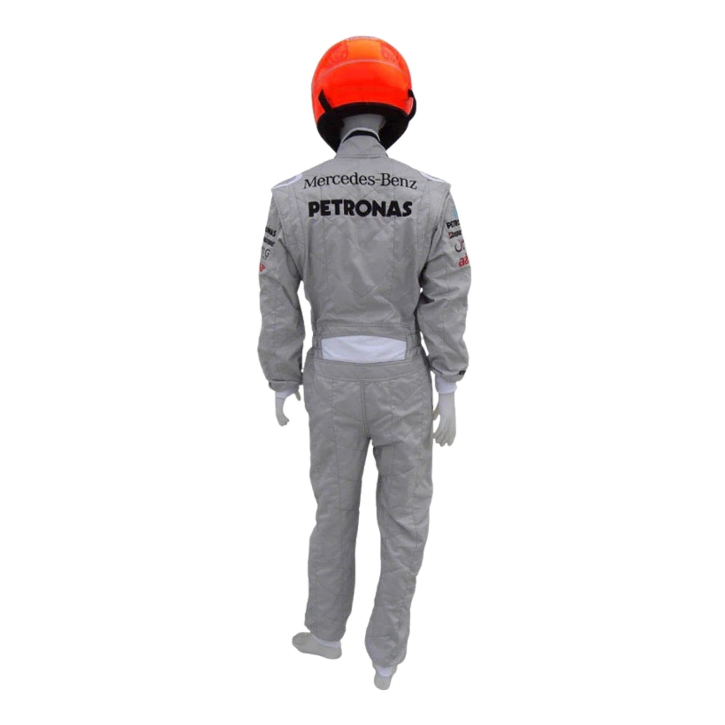 Rear view of Schumacher’s 2010 F1 suit, showcasing silver base with streamlined panels and embroidered name detailing.