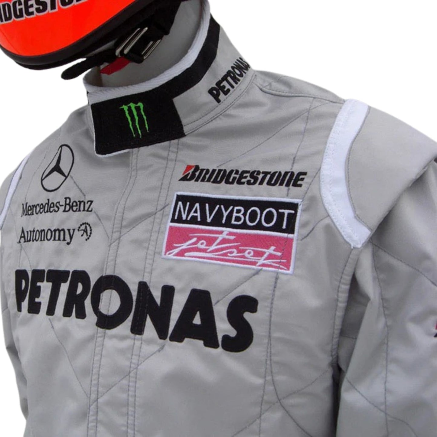 Side profile of Schumacher’s 2010 race suit with green accent lines and ergonomic seam placement for race-ready posture.