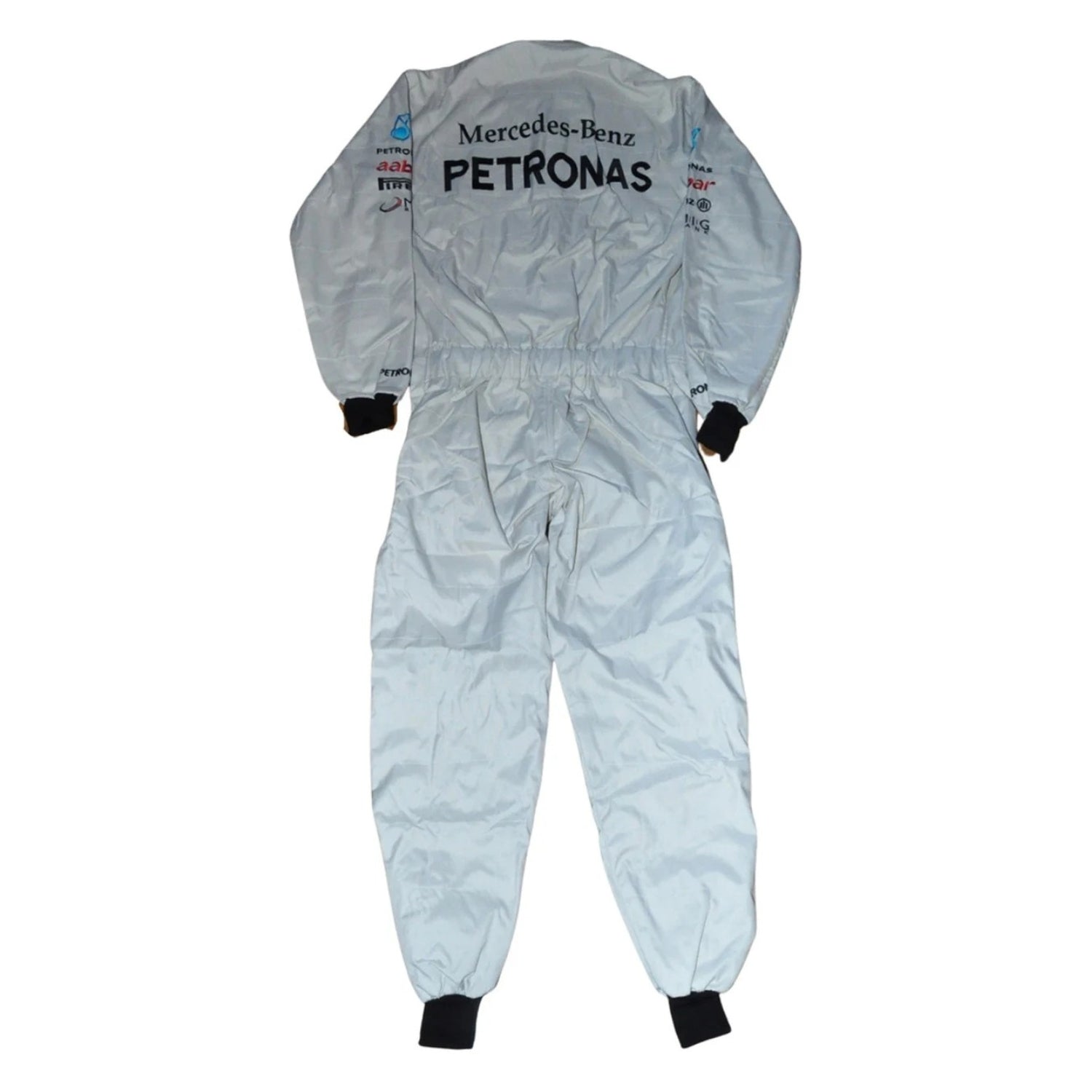 Back view of Schumacher’s 2012 F1 suit showing full-length silver material with contrasting black paneling and his signature logo on the upper back.