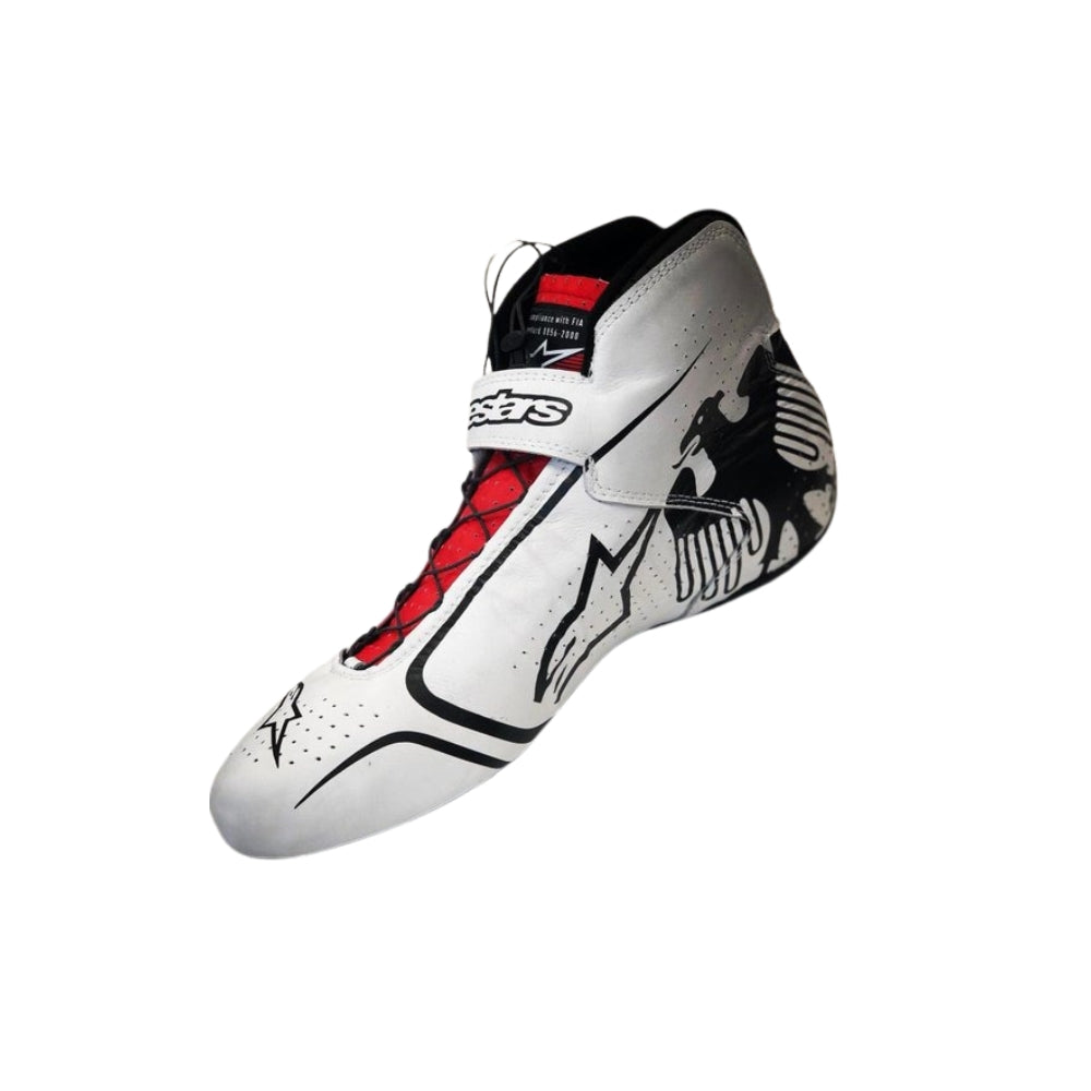 White high-top Nico Hulkenberg 2019 F1 racing shoe with black and red accents on a white background
