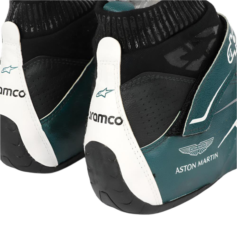 Pair of green and black Nico Hulkenberg 2022 F1 racing shoes with 'Aston Martin' branding on a white background