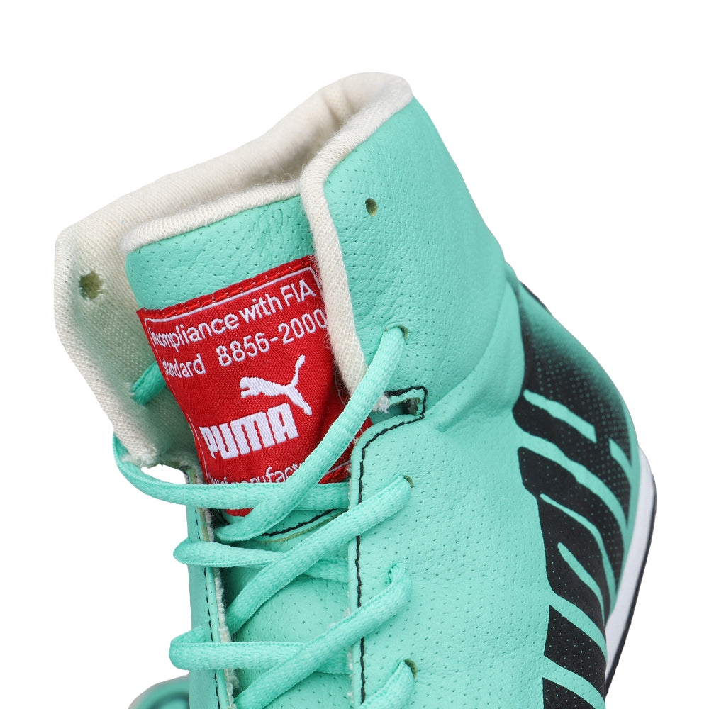 Close-up of a turquoise Puma Nico Rosberg 2017 F1 Racing sneaker with a visible brand label.