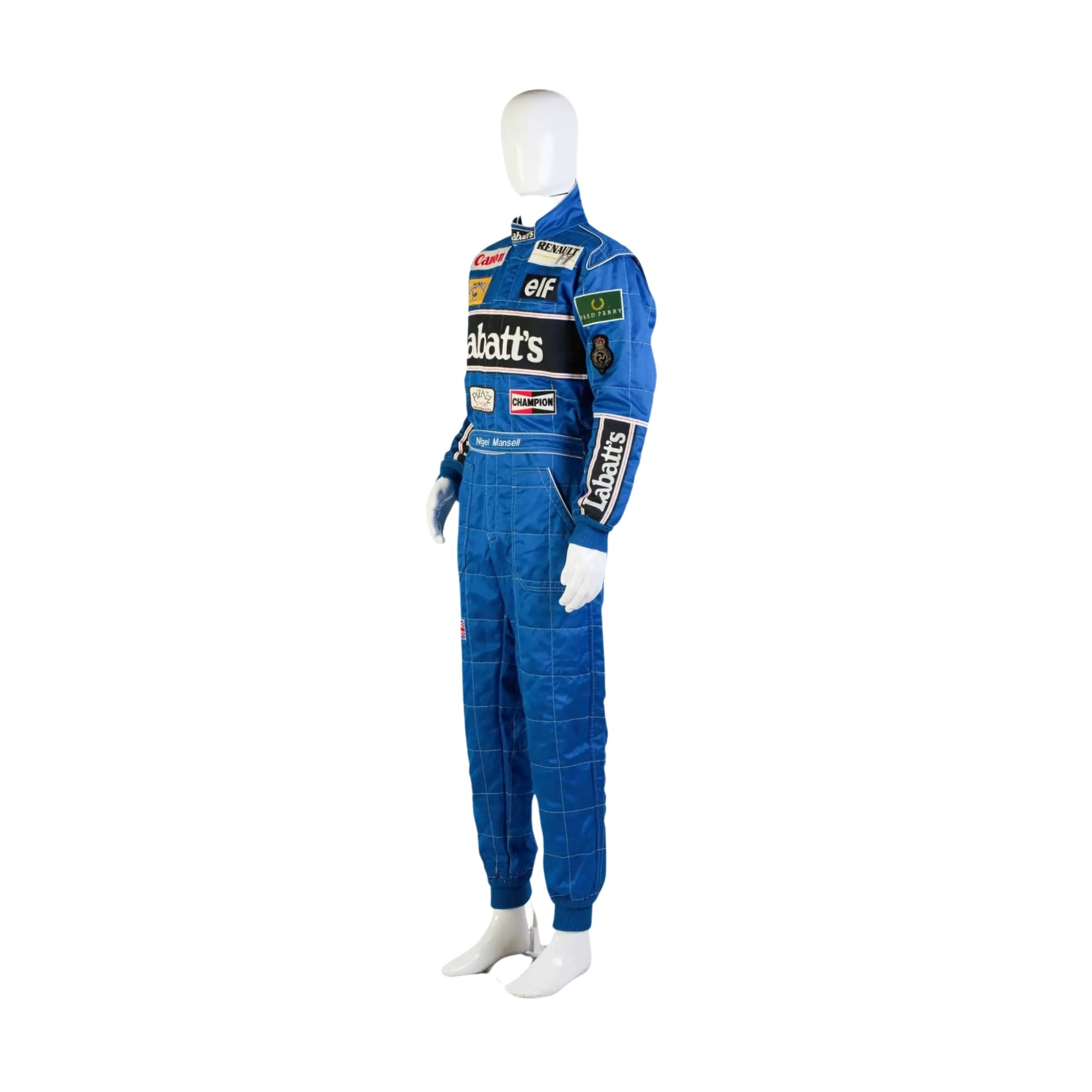Left Side profile of the 1992 racing suit worn by Nigel Mansell, showing clean tailoring, elbow patches, and side sponsor placements from his championship-winning year.