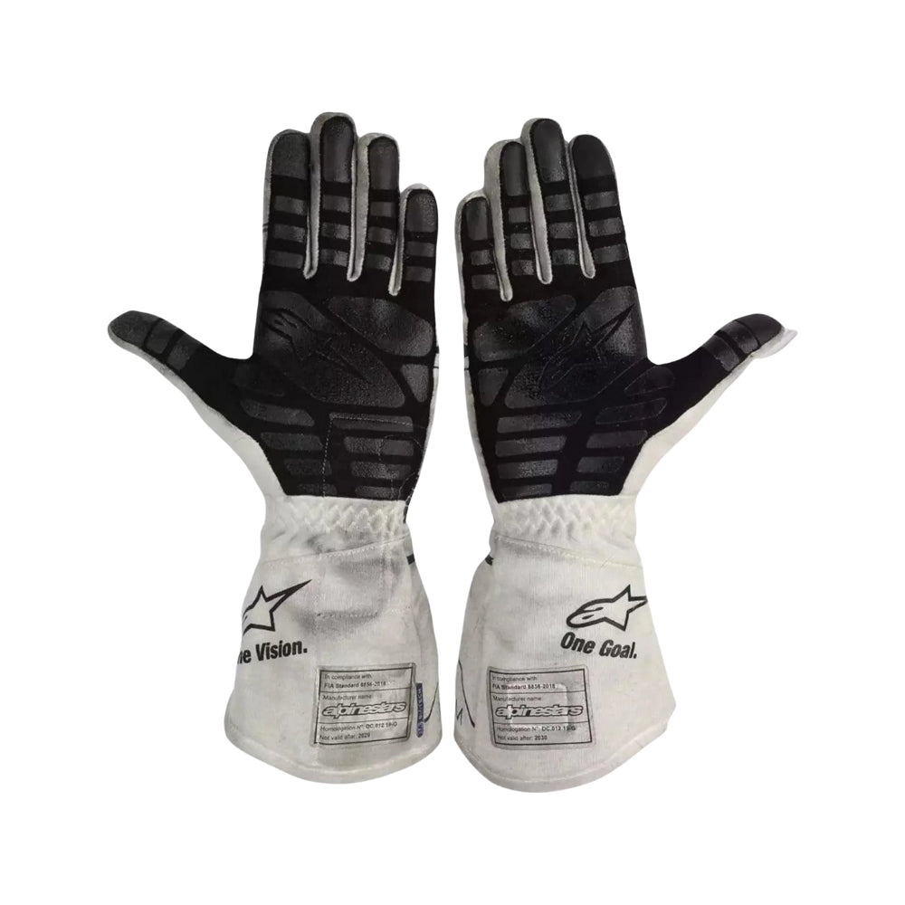 Pair of black and white Pierre Gasly 2020 F1 racing gloves with visible branding on a white background