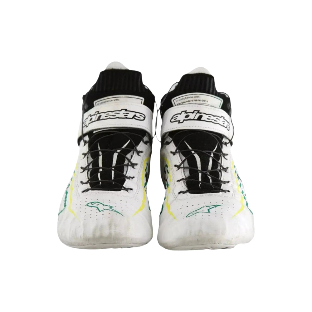 Pair of white Tony Kanaan Indy 500 2022 Chip Ganassi Racing shoes with black and green accents on a white background