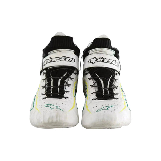 Pair of white Tony Kanaan Indy 500 2022 Chip Ganassi Racing shoes with black and green accents on a white background